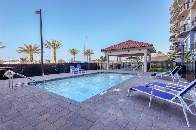 view of swimming pool with a gazebo and a patio