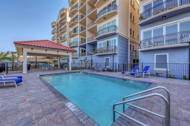 view of pool featuring a gazebo and a patio area