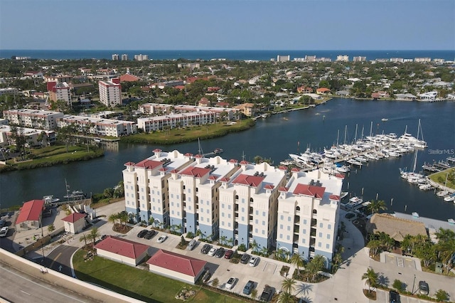 birds eye view of property with a water view