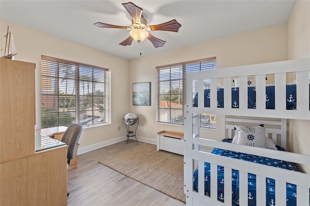 bedroom with hardwood / wood-style flooring and ceiling fan