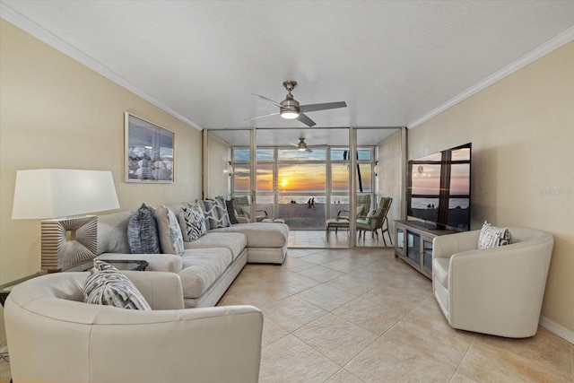 living room featuring floor to ceiling windows, ornamental molding, light tile patterned floors, and ceiling fan