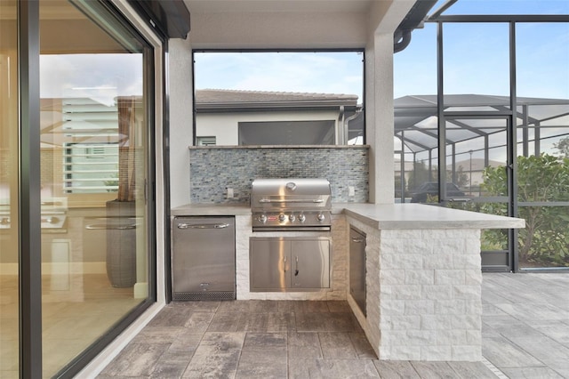 view of patio / terrace featuring grilling area and exterior kitchen