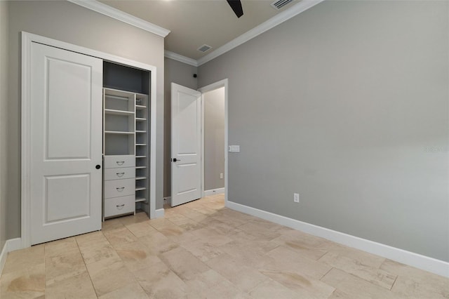 unfurnished bedroom featuring crown molding, ceiling fan, and a closet