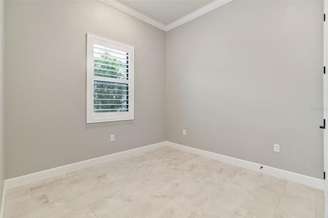 empty room featuring crown molding