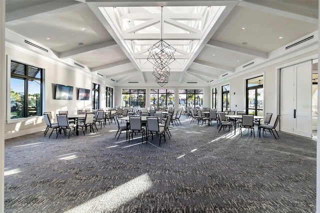 dining area with beam ceiling, carpet, and an inviting chandelier