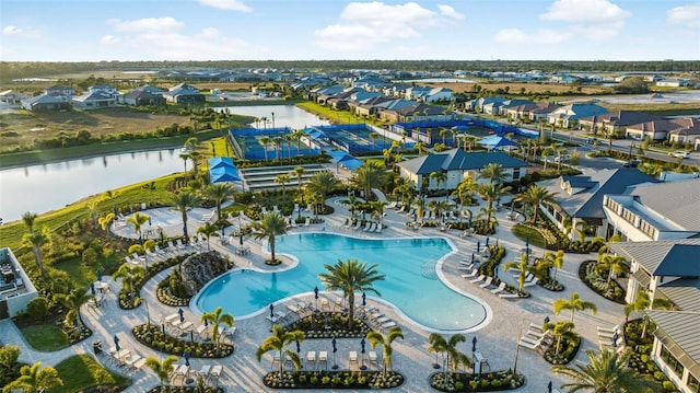 birds eye view of property with a water view