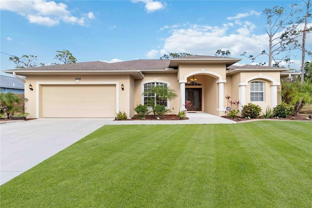 view of front of property with a garage and a front yard