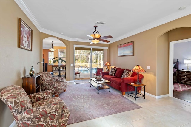 living room with ornamental molding, ceiling fan, and light tile patterned flooring