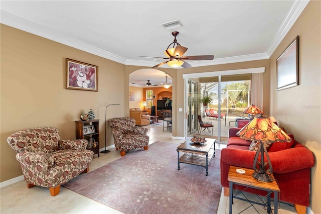 tiled living room with crown molding and ceiling fan