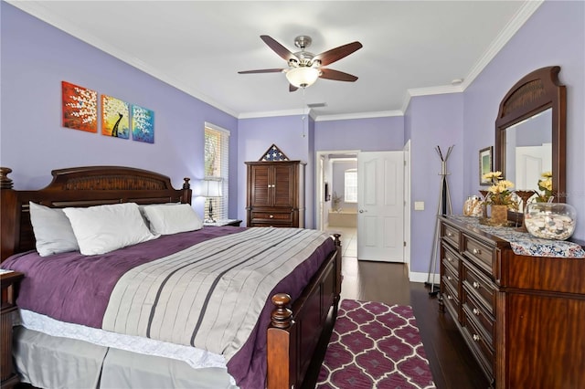 bedroom with ensuite bath, ornamental molding, dark hardwood / wood-style floors, and ceiling fan