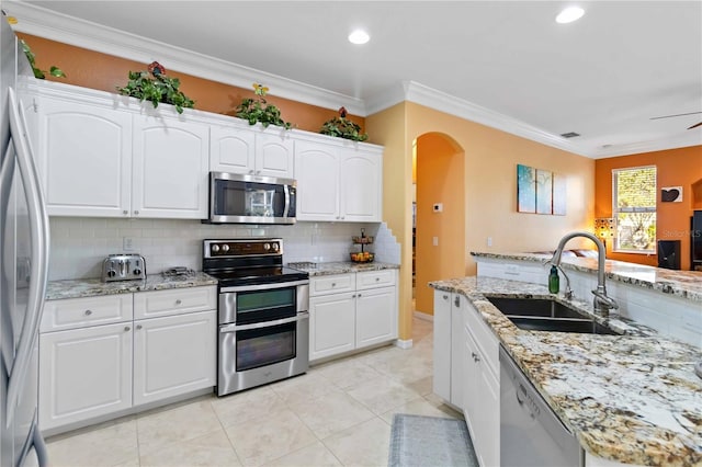 kitchen with white cabinetry, appliances with stainless steel finishes, and sink