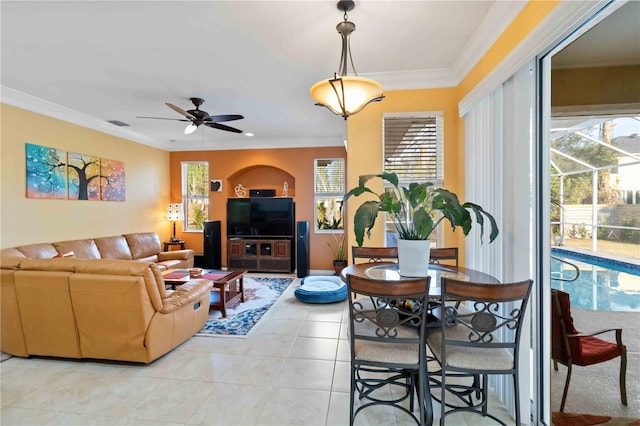 tiled living room featuring crown molding and ceiling fan