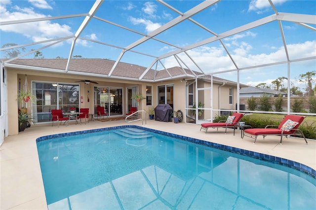 view of swimming pool featuring a lanai, area for grilling, ceiling fan, and a patio area