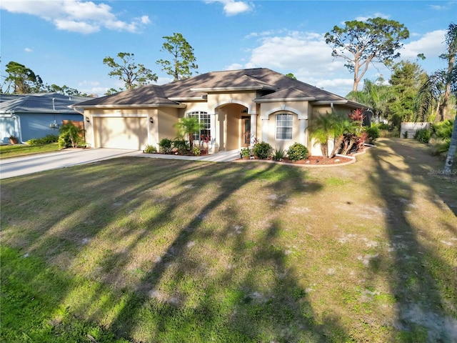 view of front of home with a garage and a front lawn