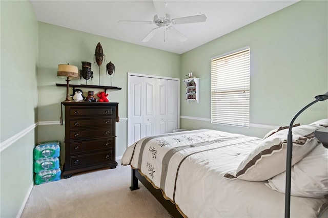 carpeted bedroom with a closet and ceiling fan