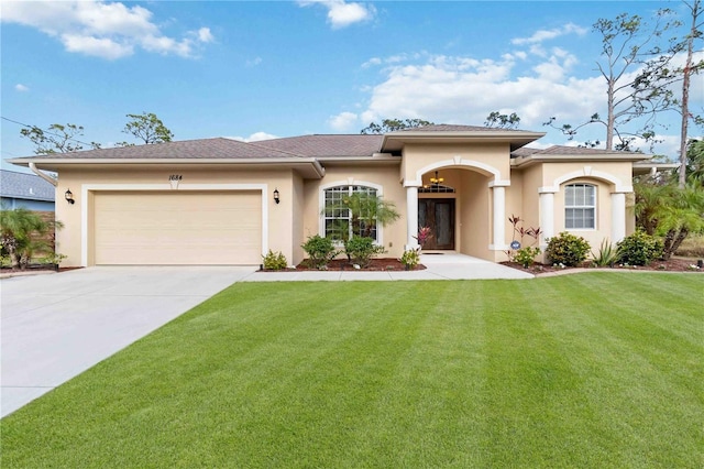1684 Ruiz St, North Port, FL 34286 - view of front of house with stucco siding, concrete driveway, a garage, a front lawn, and roof with shingles