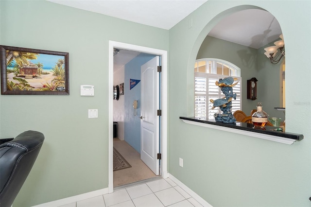 corridor featuring light tile patterned floors