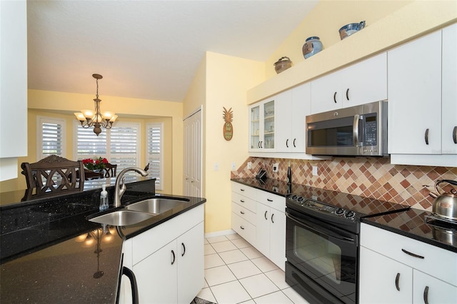 kitchen featuring pendant lighting, sink, white cabinets, decorative backsplash, and black / electric stove