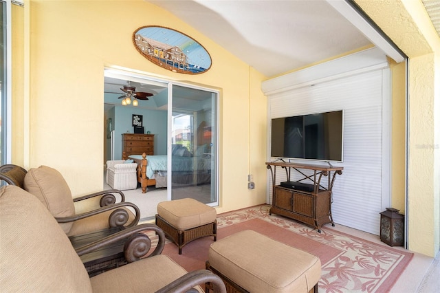 living room with lofted ceiling, light carpet, and ceiling fan