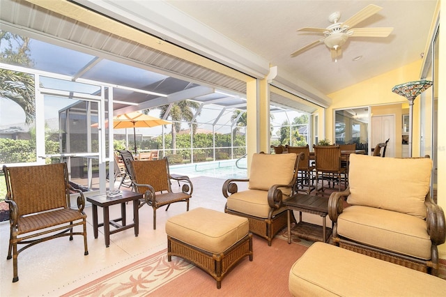 sunroom / solarium with ceiling fan and vaulted ceiling