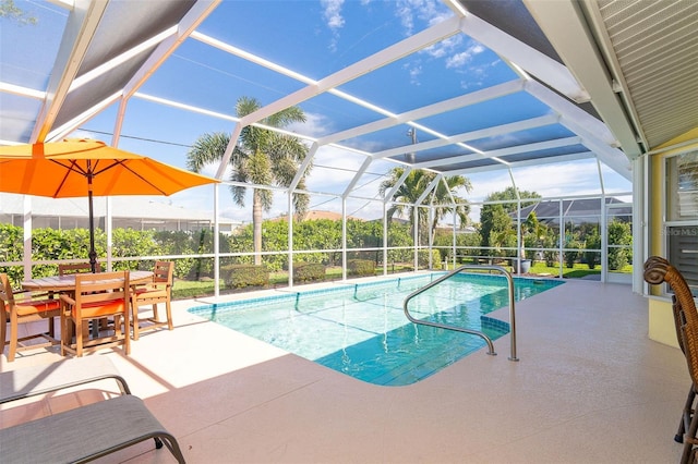 view of pool featuring a patio area and glass enclosure