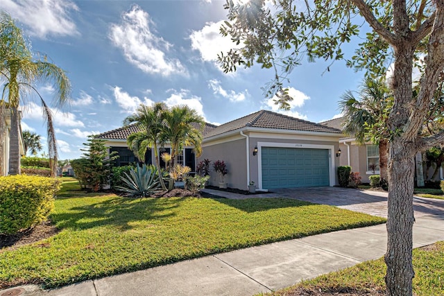 view of front of property featuring a garage and a front yard