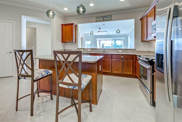 kitchen with light tile patterned floors, crown molding, appliances with stainless steel finishes, hanging light fixtures, and kitchen peninsula