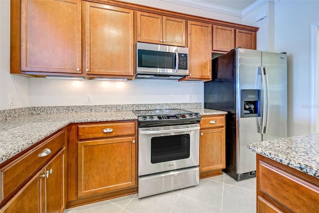 kitchen featuring light stone counters, stainless steel appliances, crown molding, and light tile patterned floors