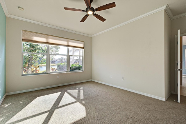 carpeted spare room with crown molding, a water view, and ceiling fan