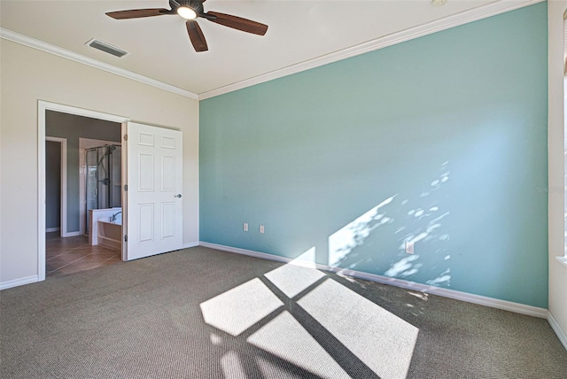 unfurnished bedroom with dark colored carpet, ceiling fan, and crown molding