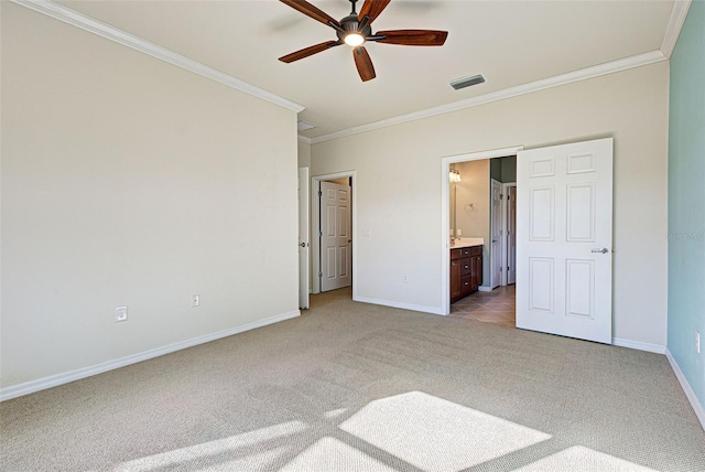 unfurnished bedroom with crown molding, connected bathroom, light carpet, and ceiling fan