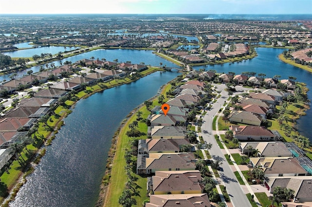 drone / aerial view with a water view