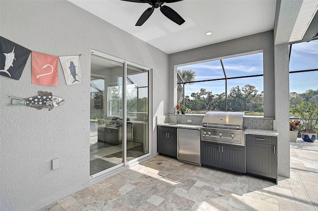 view of patio featuring a grill, glass enclosure, ceiling fan, and an outdoor kitchen