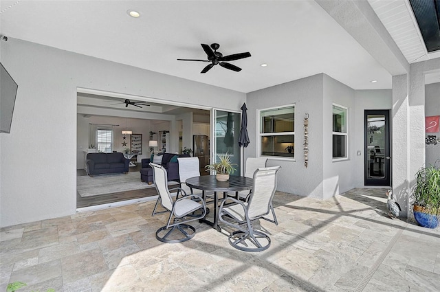 view of patio / terrace featuring ceiling fan