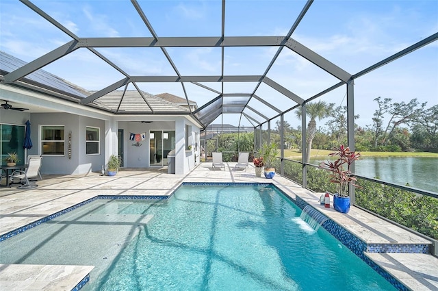 view of pool featuring a lanai, ceiling fan, a patio, a water view, and pool water feature