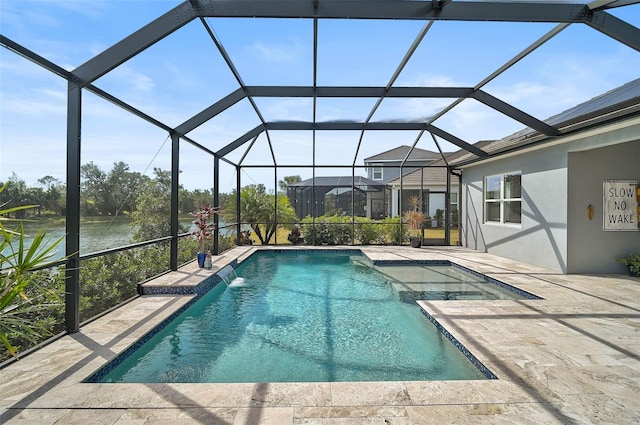 view of pool featuring a patio, a water view, pool water feature, and glass enclosure