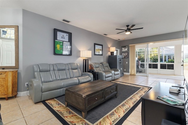 tiled living room featuring ceiling fan