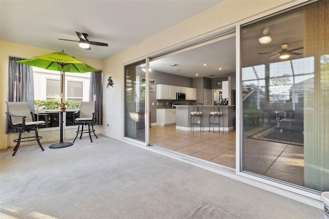 interior space featuring ceiling fan