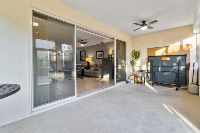 interior space featuring ceiling fan