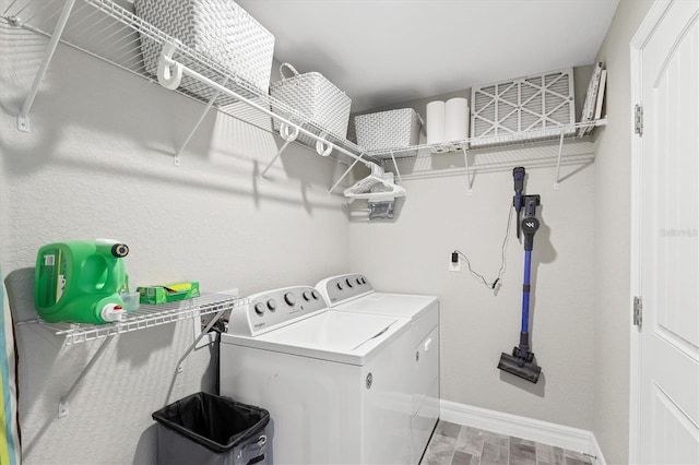 laundry room with wood-type flooring and washing machine and dryer