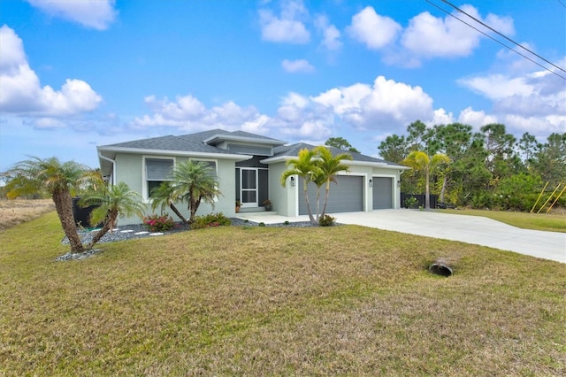 view of front of property with a garage and a front lawn