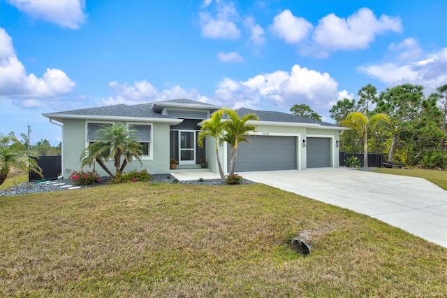 view of front of home featuring a garage and a front yard