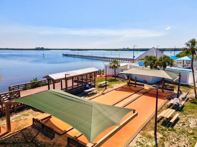 surrounding community featuring a water view