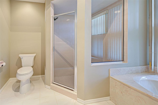 bathroom featuring tile patterned floors, plus walk in shower, and toilet