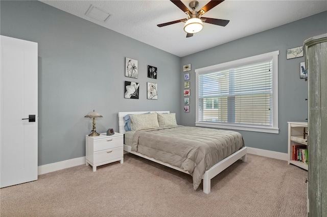 bedroom with light carpet and ceiling fan