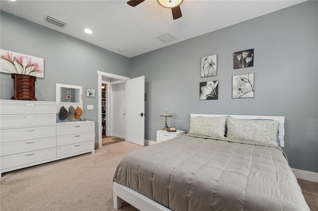 bedroom with light carpet and ceiling fan