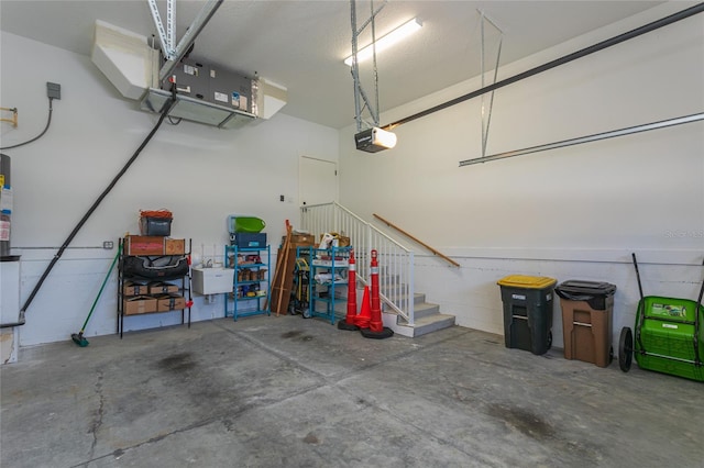 garage featuring a garage door opener and sink