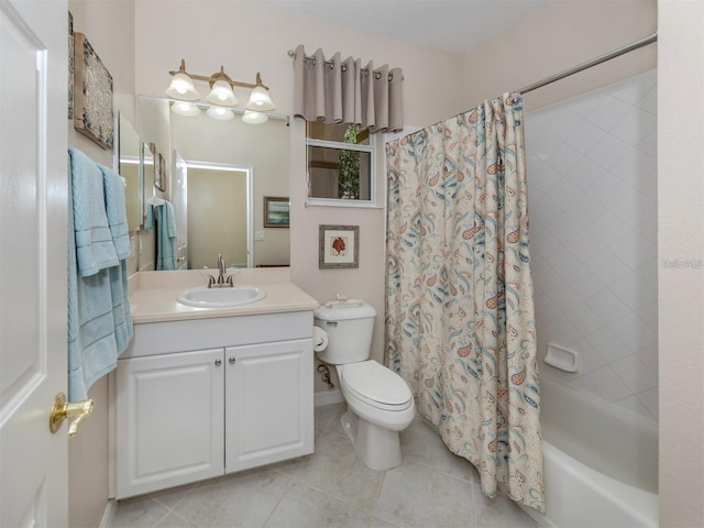 full bathroom with vanity, tile patterned floors, toilet, and shower / bath combo with shower curtain