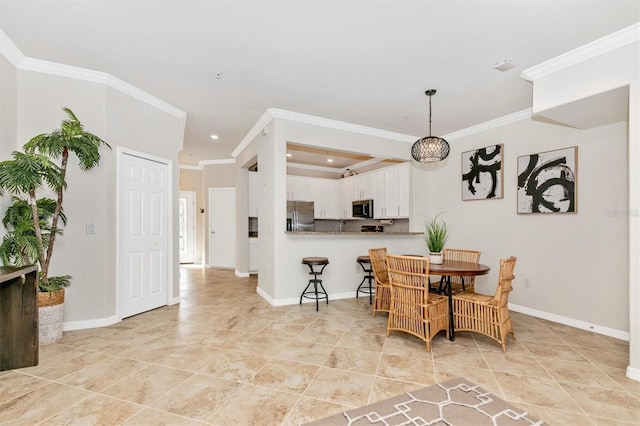 dining space featuring crown molding and light tile patterned floors