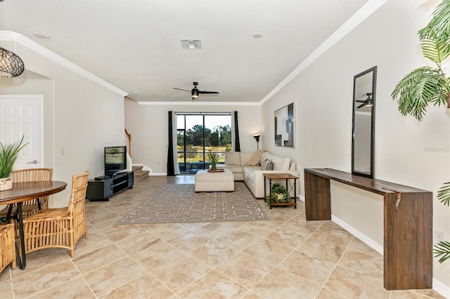 living room with ornamental molding and ceiling fan